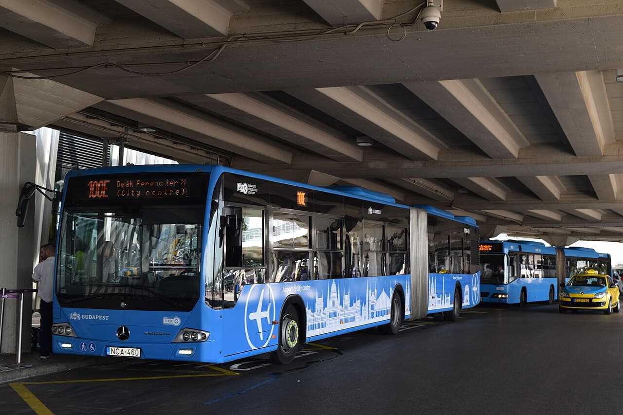 Blue route 100E bus at Budapest Airport with a 200E bus behind it.