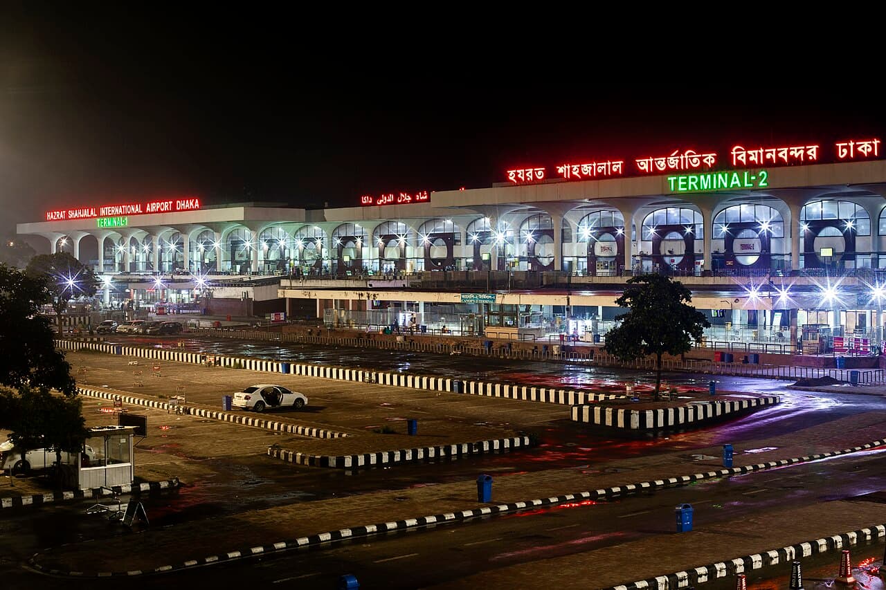 Illuminated Hazrat Shahjalal International Airport terminal in Dhaka at night