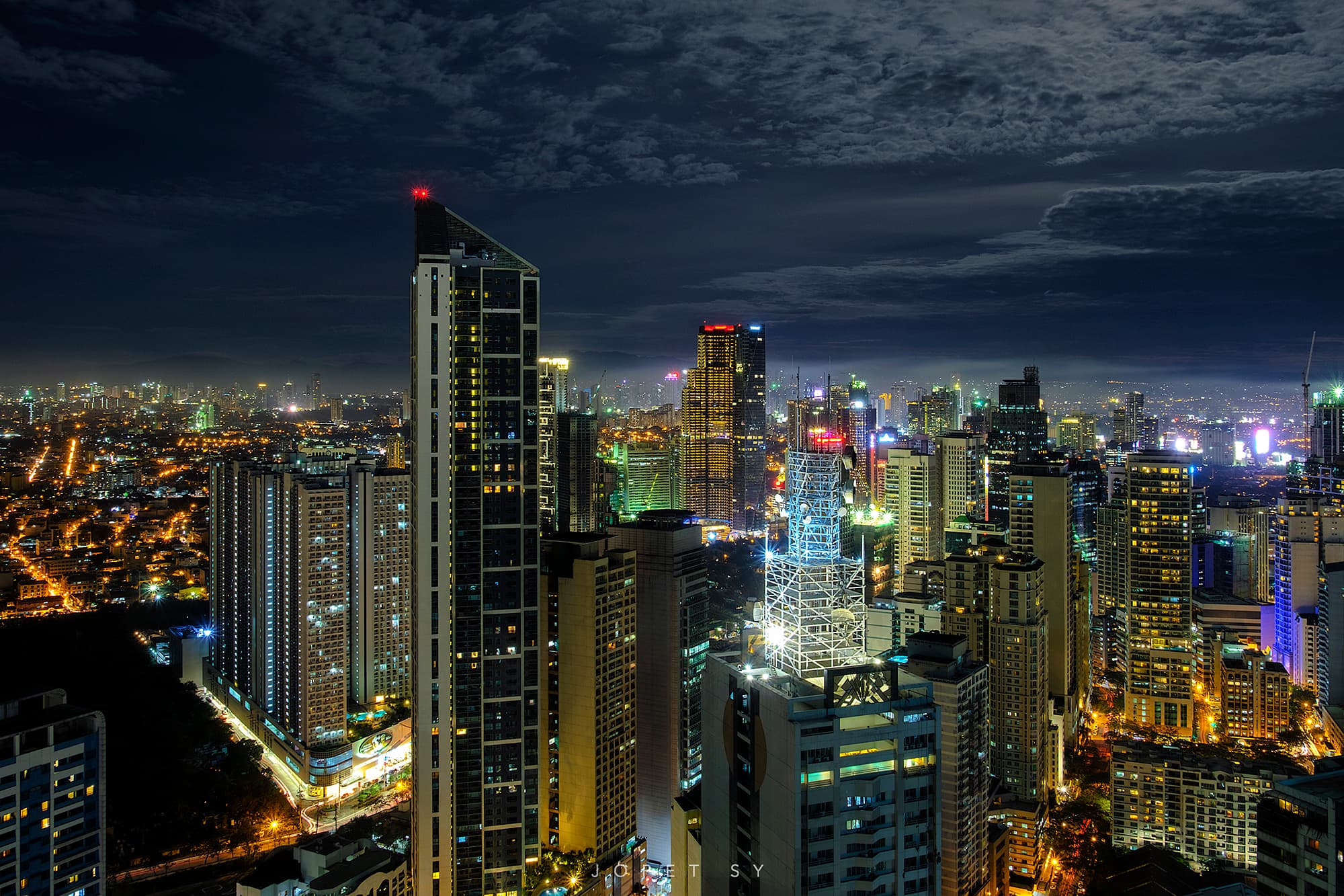 Illuminated Makati skyline and streets at night