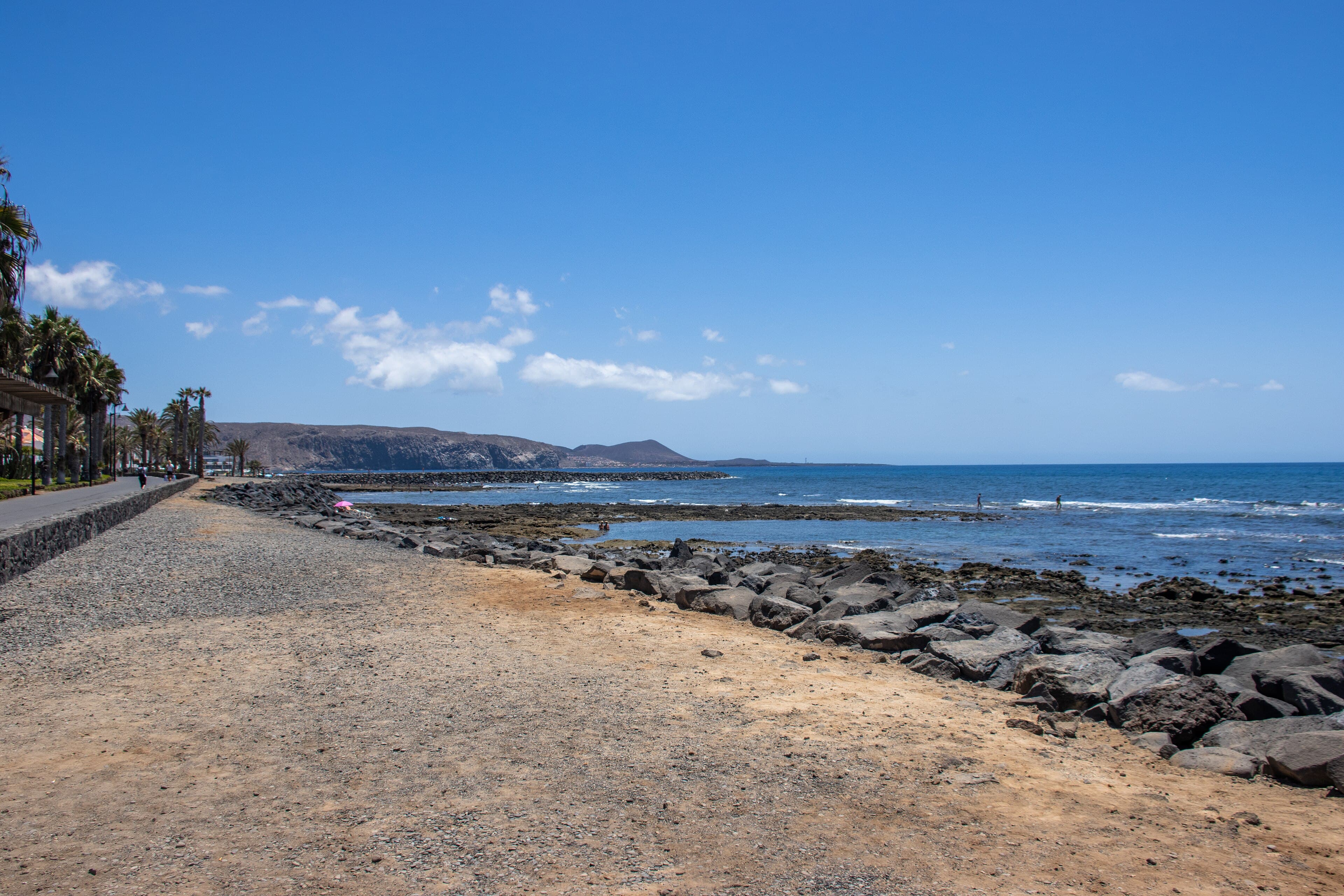 Promenade and rocky shore at Playa de las Américas on Tenerife