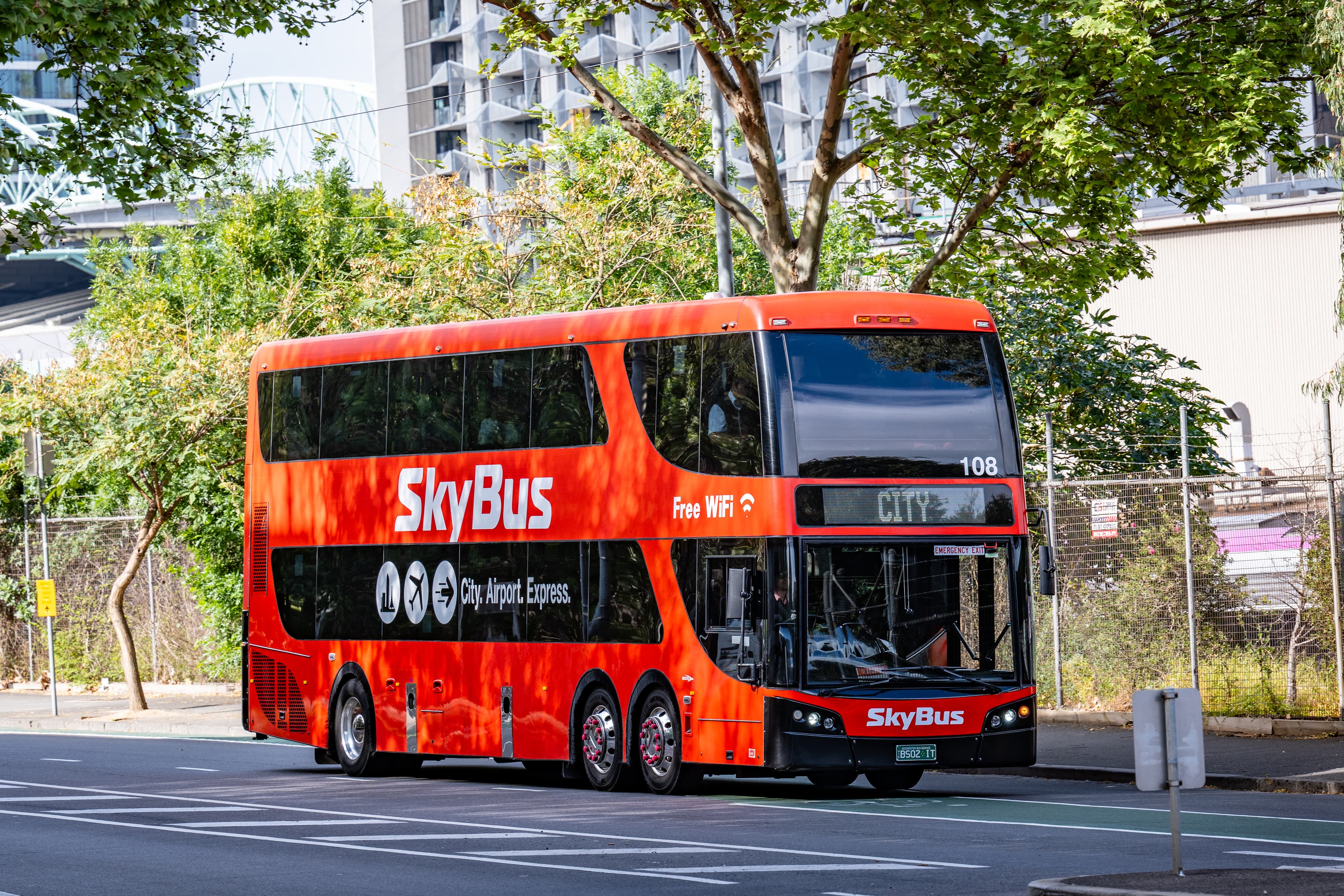 Red SkyBus double-decker airport coach on Adderley Street in Melbourne