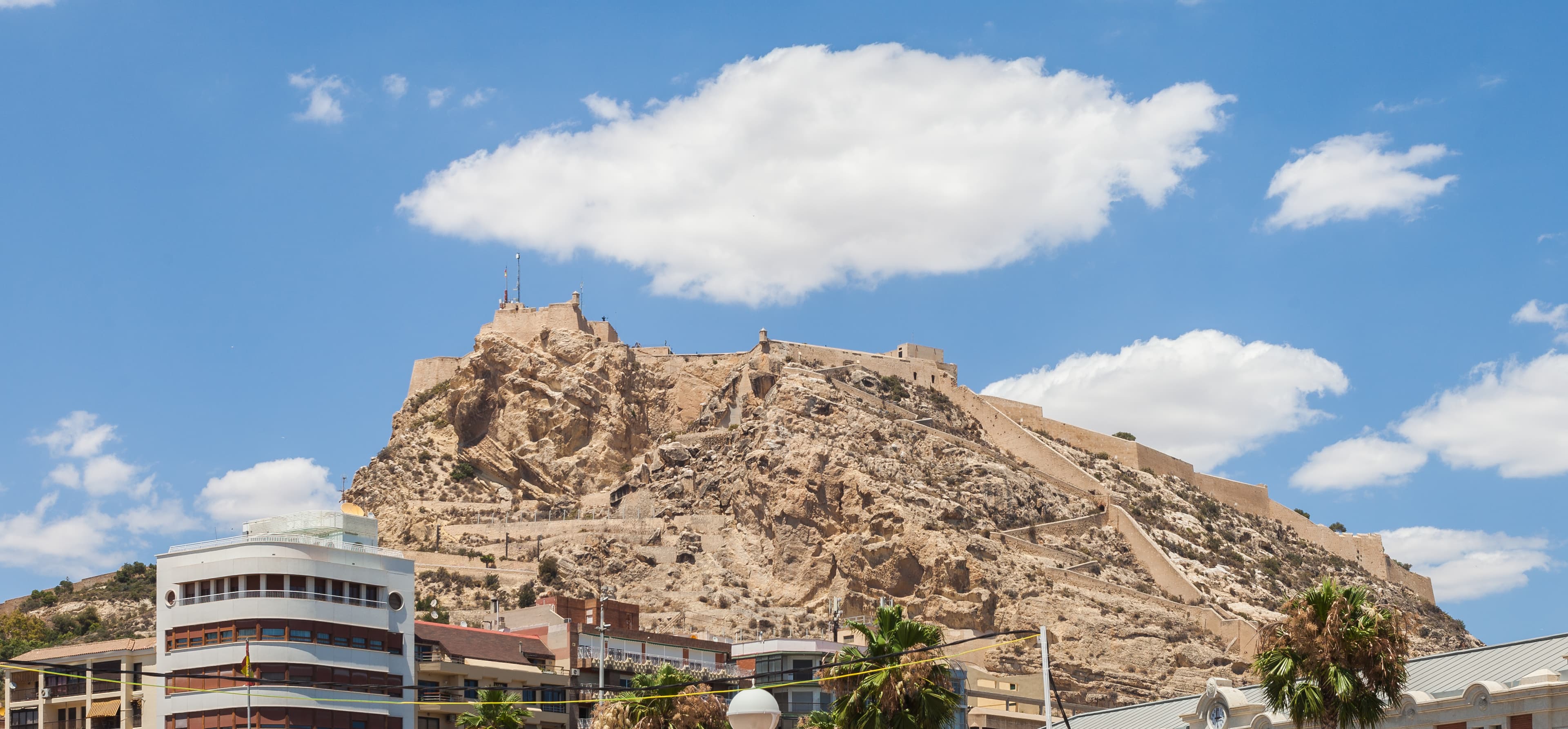 Santa Bárbara Castle above central Alicante under a blue sky
