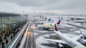 Northeast blizzard grounds thousands of flights, complicating airport transfers and rail links